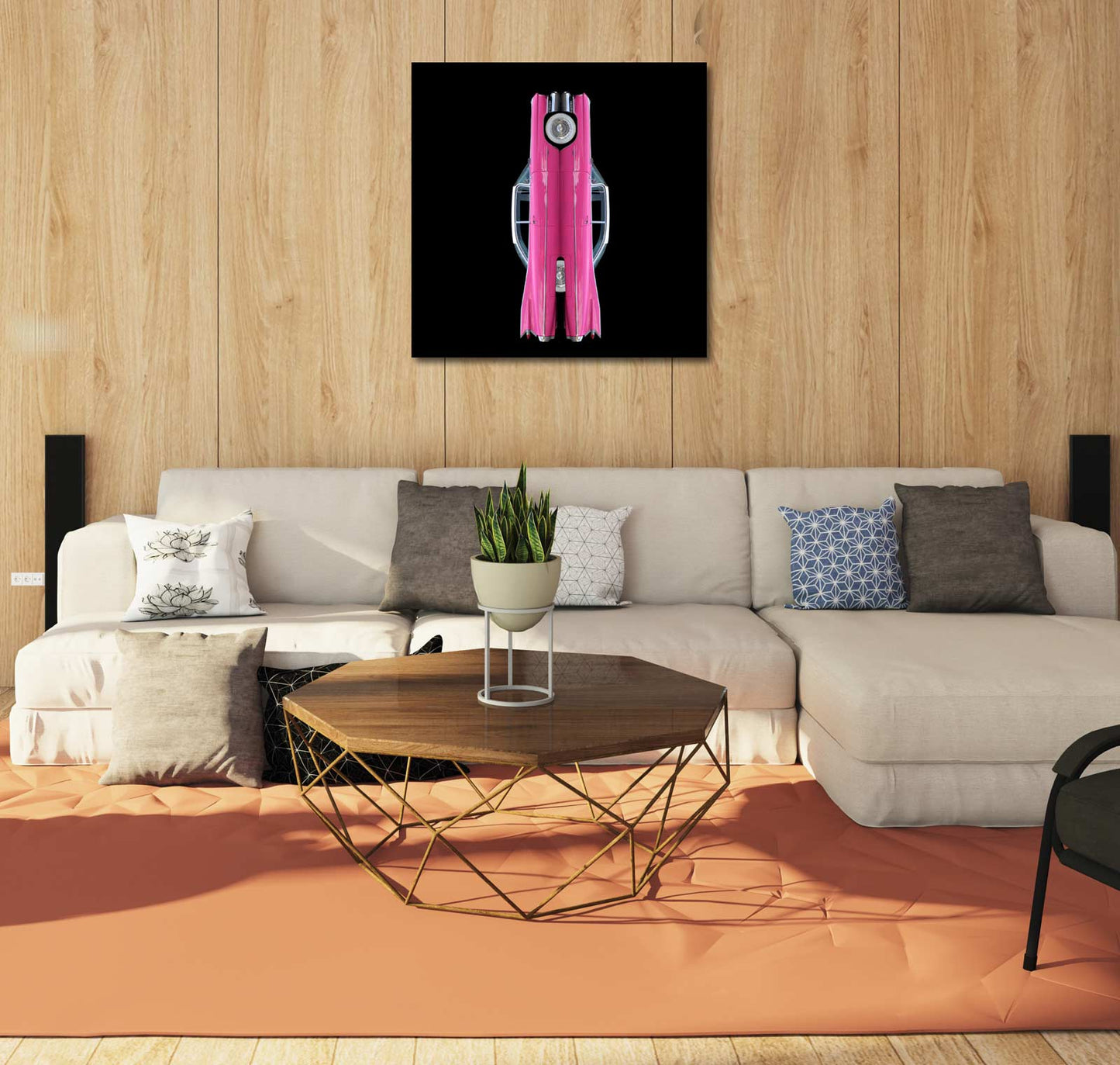 Ein legendärer Heckflossen Cadillac in Pink, gespiegelt vor schwarzem Hintergrund, Format quadratisch, an brauner Holzwand mit hellem Sofa hängend
